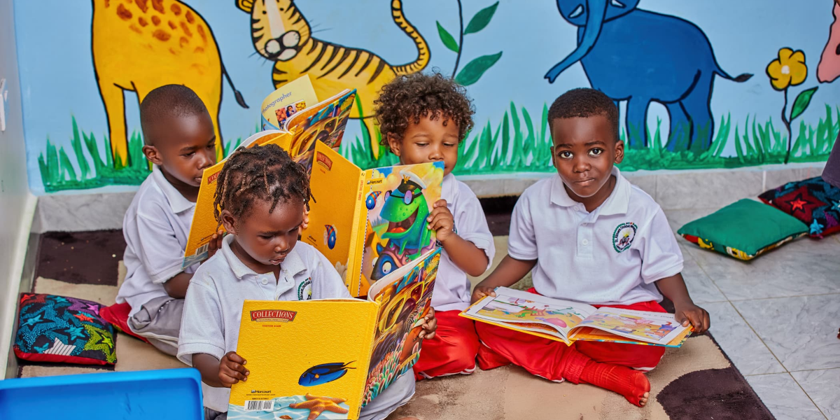 Teacher assisting students with reading